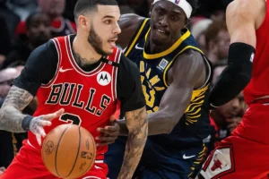 lonzo ball is going to goal by loosing cavs isaac okoro