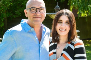 Gregg Wallace smiling with wife Anne-Marie Sterpini at a formal event