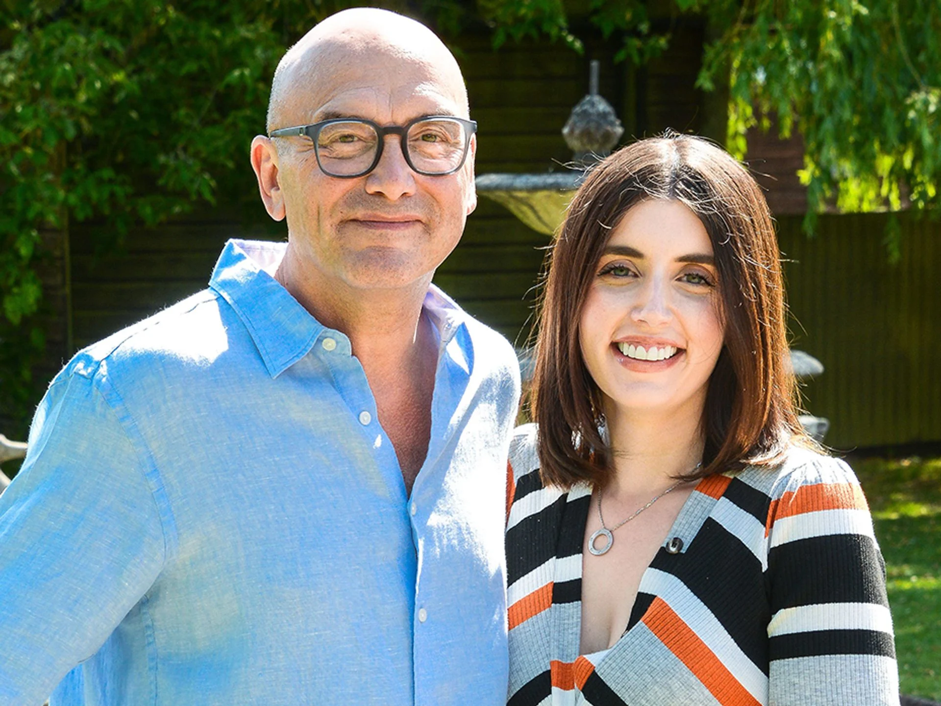 Gregg Wallace smiling with wife Anne-Marie Sterpini at a formal event